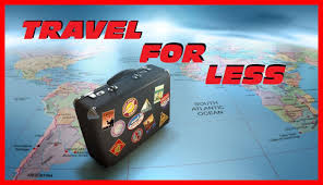 Travel and more and travel for less. Pictured is a suitcase with stickers setting on a large picture of a world map