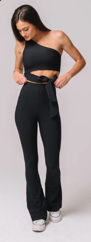 Woman sporting athletic wear of a Regal Ribs Flare Pant outfit suitable for day or evening attire. 